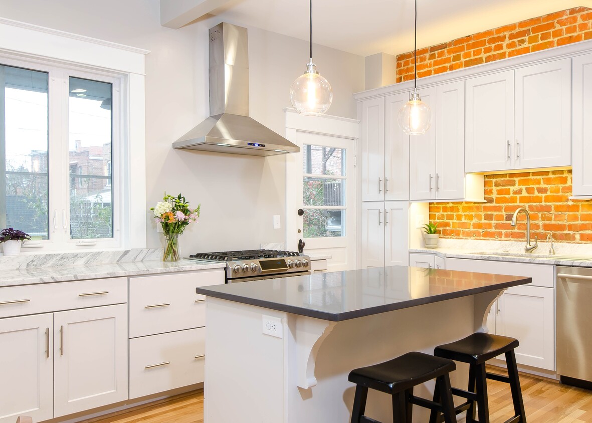 Gourmet Kitchen with exposed brick - 106 N Belmont Ave