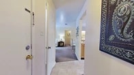 Located at 9250 Dean Rd in Shreveport, Louisiana, this well-appointed 2-bedroom, 2-bathroom residence offers a thoughtfully designed single-floor layout that maximizes every square foot. A welcoming hallway with tile flooring connects the main living areas, offering glimpses into the carpeted bedrooms and adjacent bathroom vanity as you move through the space.

The galley-style kitchen is efficiently organized, featuring warm wood cabinetry, ample counter space, a double sink, and a full suite of appliances including a refrigerator, electric range, and built-in microwave. Tile flooring runs throughout the kitchen, adding durability and ease of maintenance.

Both bedrooms are carpeted and comfortably sized, with the primary bedroom offering a notable feature: direct outdoor access through a sliding glass door that fills the room with natural light. A dedicated walk-in closet with wire shelving provides generous storage. The second bedroom also includes convenient closet access.

The two bathrooms are clean and functional, each featuring wood-toned vanity cabinetry, a single-basin sink, and light countertops. One bathroom includes a shower-tub combination. A dedicated laundry room houses a full-size washer and dryer, adding everyday convenience. Overall, the space presents a neutral, move-in-ready aesthetic with a warm and practical feel.