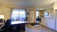 Located in Dublin, Ohio, this two-floor residential property at 6564 Millridge Cir offers a well-organized layout designed for everyday comfort. The main living area features carpeted flooring and is filled with natural light streaming through large windows dressed with light curtains, creating a bright and welcoming atmosphere. The front entry opens directly into this open space, which connects seamlessly to a dedicated dining area — ideal for both casual meals and entertaining. The kitchen is efficiently arranged in a galley-style configuration, featuring stainless steel appliances including an electric range and refrigerator, ample cabinetry providing generous storage, a double stainless steel sink, and a textured ceiling with overhead fluorescent lighting. Light-toned countertops and a neutral color palette give the kitchen a clean, practical feel. An interior door in the kitchen leads to additional areas of the home. The overall aesthetic throughout the space is understated and functional, with warm neutral tones complementing the layout across both floors. The property's location within the established Millridge Circle neighborhood in Dublin, OH offers convenient access to local amenities, schools, and community resources.
