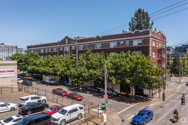 Trees Lining the Building Along NW 16th Avenue - The Empress Building