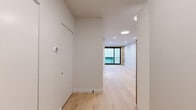 Located at 1706 Sherman Ave in Evanston, IL, this thoughtfully designed one-bedroom, one-bathroom unit offers a clean, modern aesthetic across a single floor. Light-toned hardwood flooring flows throughout, creating a cohesive and airy feel. The open layout connects the living area to the kitchen, maximizing the efficient use of space.

The kitchen is outfitted with two-tone cabinetry — warm wood lower cabinets paired with crisp white upper cabinets — complemented by a tiled backsplash, quartz-style countertops, a black matte faucet, and stainless steel appliances including a range, dishwasher, and refrigerator. Recessed lighting enhances the clean, contemporary finish.

The living area is bright and open, highlighted by a striking exposed brick accent wall framing large black-framed sliding glass doors that lead to a private balcony, allowing natural light to pour in. The bedroom is a well-proportioned retreat, also featuring recessed lighting and exposed brick detailing around a large black-framed window.

The bathroom is finished with floor-to-ceiling grey tile, a frameless glass-enclosed walk-in shower with a linear drain, matte black fixtures, and a built-in niche — delivering a spa-like, refined atmosphere. Overall, the unit presents a polished, modern design with carefully selected finishes throughout.