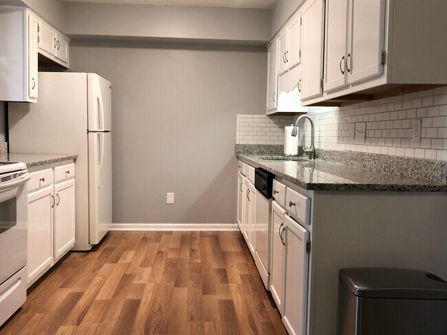 updated kitchen with granite counters and dishwasher - 7123 W Friendly Ave