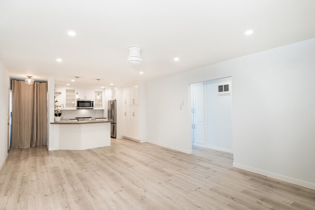 Kitchen and laundry (behind curtain) view from living room area - 15 15th St