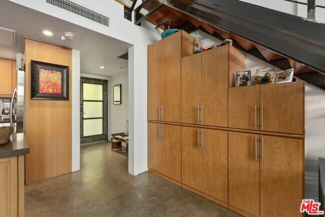 Storage cabinets under stairs - 3638 Hughes Ave