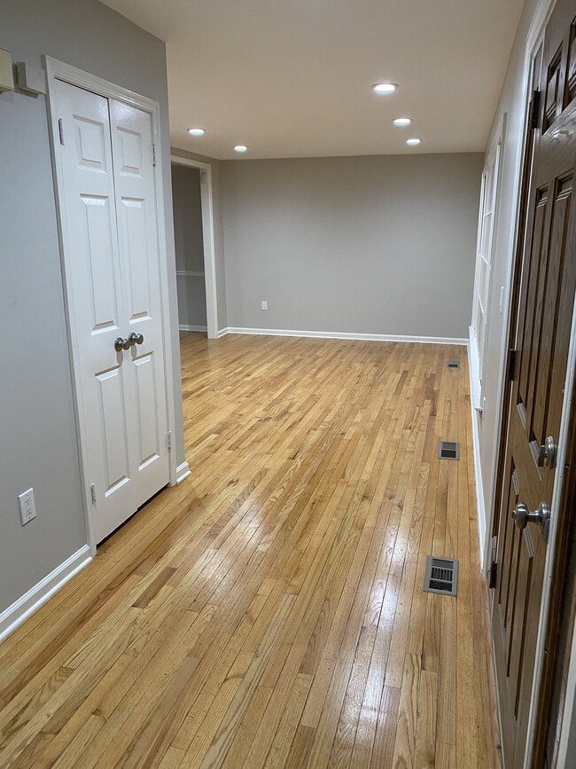 Entrance foyer, front hall closet and living room - 1616 Briggs Chaney Rd