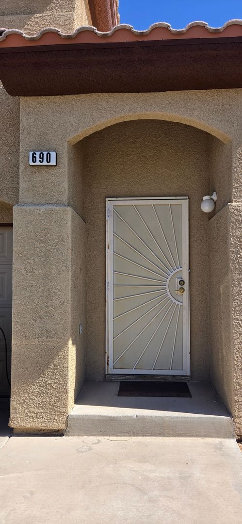 Building Photo - Two story 2 bedroom townhome with newer flooring, paint & appliances - community pool!