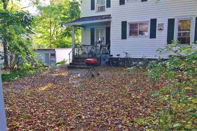 backyard with rear porch (shed/garage no longer there all parking now) - 14 Wurts Ave