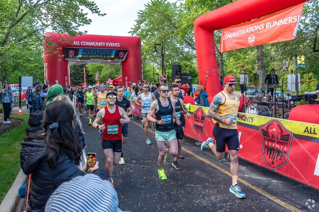 Chicagoland Spring Marathon runners take off from the start line heading towards Rolling Meadows.