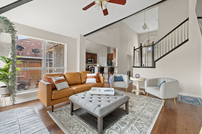 Living room-Dark out blinds not pictured, 65"smart4K TV, curated furnishings and art, luxury sofa - 4330 Saint Francis Ave