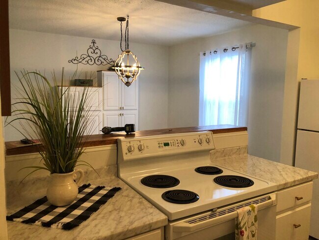Kitchen into dining room - 724 Azalea Dr
