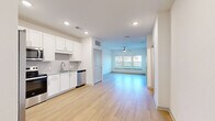 Located at 12020 Brush Hill Rd in Wildwood, Florida, this single-story residence offers a thoughtfully designed one-bedroom, one-bathroom layout that maximizes functionality and comfort. The open-concept living and dining area is bright and airy, featuring light wood-tone flooring, recessed lighting, and a ceiling fan, creating an inviting atmosphere. Large windows allow natural light to fill the space, enhancing its clean, modern aesthetic.

The kitchen is well-equipped with crisp white shaker-style cabinetry, granite countertops, a tile backsplash, and a full suite of stainless steel appliances, including a refrigerator with ice and water dispenser, electric range, over-the-range microwave, and dishwasher. The light wood flooring continues seamlessly from the living area into the kitchen.

The bedroom offers a comfortable, carpeted retreat with a ceiling fan, natural light from a window with blinds, and access to a dedicated closet. The full bathroom is finished with white cabinetry, granite countertops, a single vanity with mirror, and a tub-shower combination with white tile surround, all complemented by the same light wood flooring found throughout the main living areas.