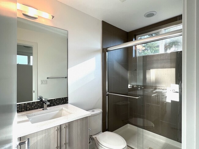 En suite off of the first floor bedroom. - 211 13th Ave E