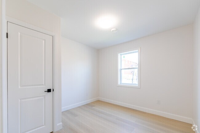 2 chambres, 1 salle de bain - 645 pi2 - Chambre - Mad Mill Apartments