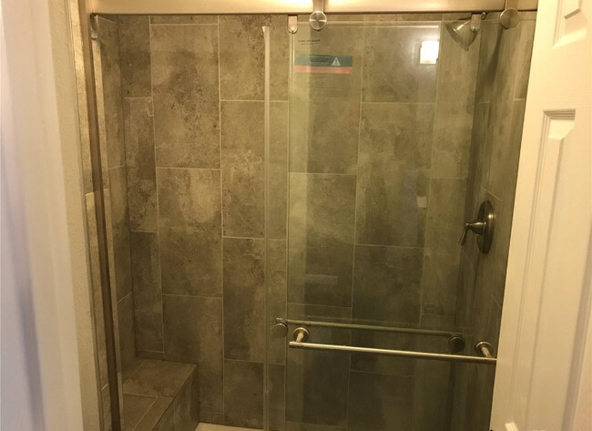 Primary shower with bench - 919 S Granby Way