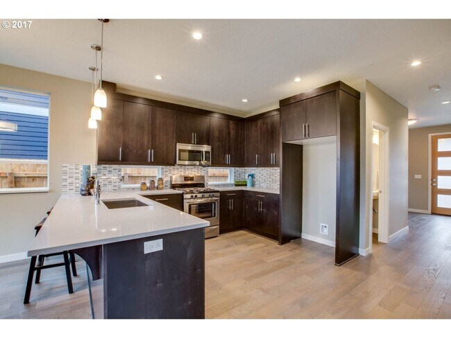 Building Photo - Charming 3BR Home with Fireplace, Bright Open Living Spaces & Loft