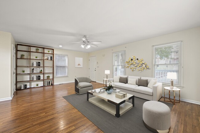 Large living room with a cozy bookcase for added charm - 247 Farrington Ave SE