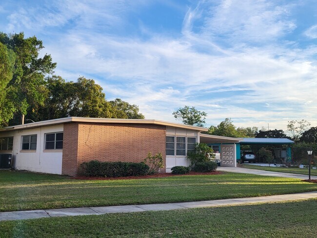 North view of property showing large bank of lwindows.. - 4425 Bradley Ave