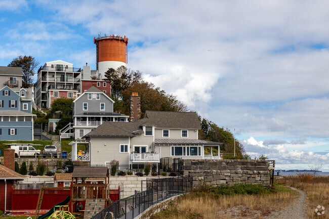 Picturesque houses sit on the hills just above the water.