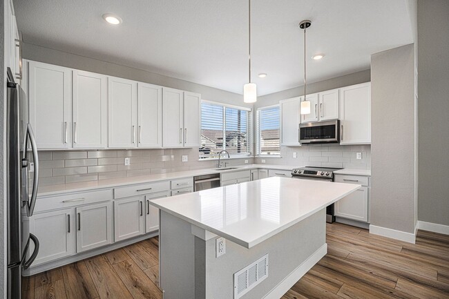 Building Photo - Modern 3-Story End Unit with Designer Fini...