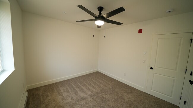 Unfurnished Bedroom with ceiling fan, view 2 - Southgate Gardens Apartments