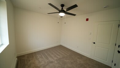 Unfurnished Bedroom with ceiling fan, view 2 - Southgate Gardens Apartments