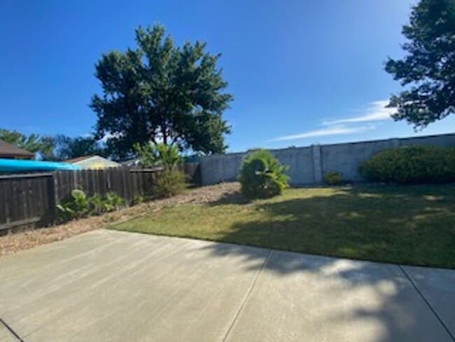 Building Photo - Huge semi-private Backyard with Large Patio!
