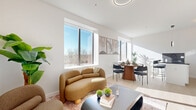 This thoughtfully designed one-bedroom, one-bathroom unit at 540 Bond Street in Bridgeport, CT offers a bright and modern living experience across a single floor. The open-concept layout seamlessly connects the living room, dining area, and kitchen, creating a cohesive and functional space bathed in natural light from large, modern windows that frame outdoor views of the surrounding neighborhood.

The kitchen is outfitted with sleek white cabinetry accented by gold hardware, dark speckled stone countertops, a matching dark backsplash, and a full suite of stainless steel appliances including a refrigerator, oven, microwave, and dishwasher. A sculptural pendant light adds a striking design touch overhead. Light wood-tone flooring flows throughout the open living areas, enhancing the airy, contemporary feel.

The bedroom is a serene retreat, featuring large windows that invite ample sunlight and outdoor views, light wood flooring, and a built-in climate control unit. Two closets provide generous storage throughout the unit.

The bathroom features a clean, all-white design with a combination tub and shower fitted with matte black fixtures, complemented by terrazzo-style flooring. Every detail of this unit reflects a modern, refined aesthetic tailored for comfortable everyday living.