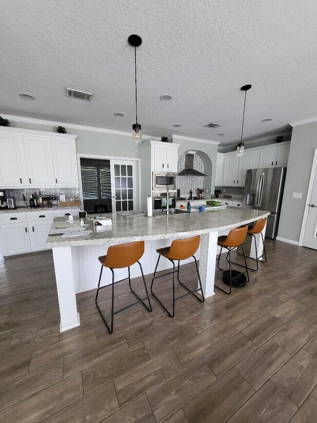 Kitchen- French doors connect to tenant's living room - 3144 Tina Marie Dr
