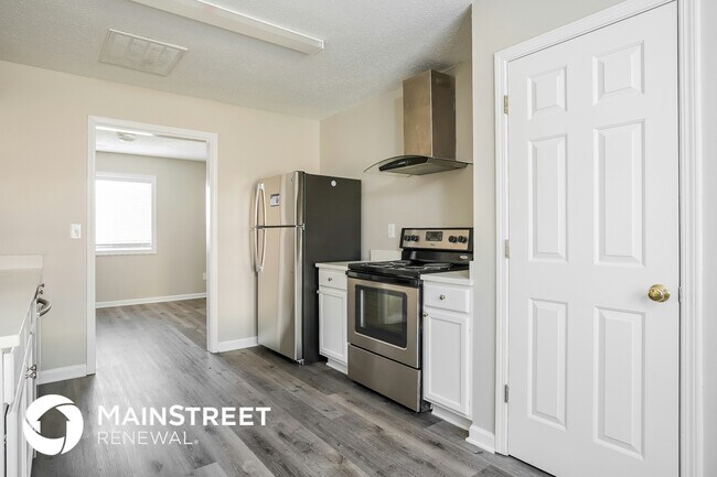 Foto del edificio - 5504 Carriage Woods Dr