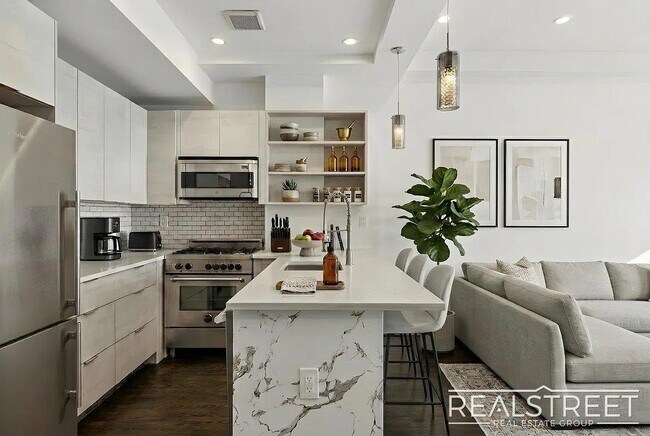 Building Photo - Modern Bushwick 2-bedroom, 2.5-bath duplex with private garden, deck, and finished recreation room —