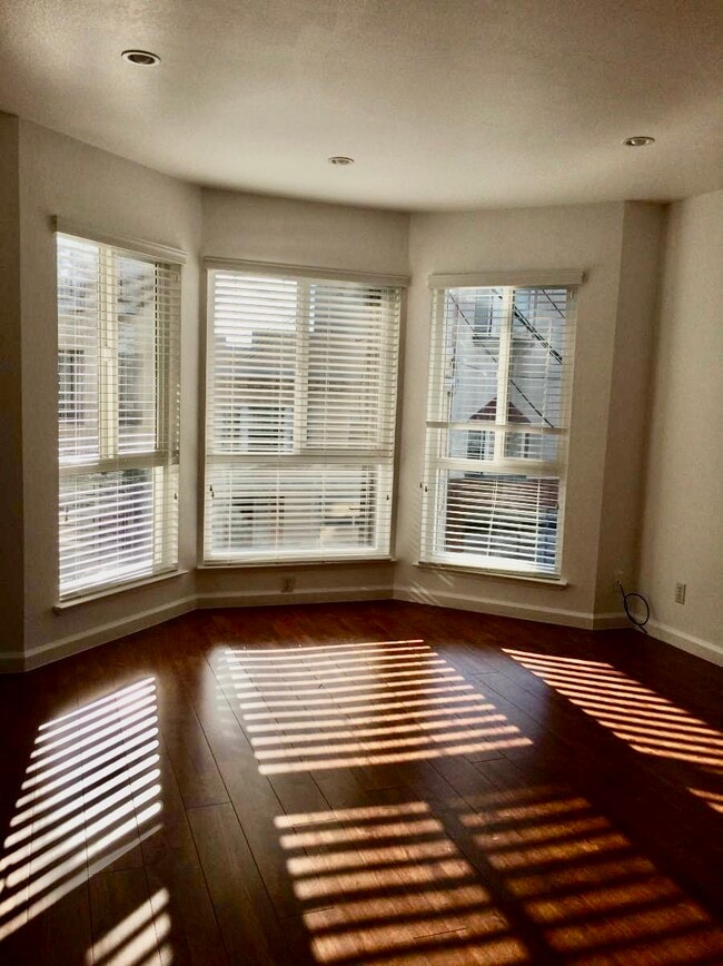 Separate living room with bay windows! - 732 Spruce St