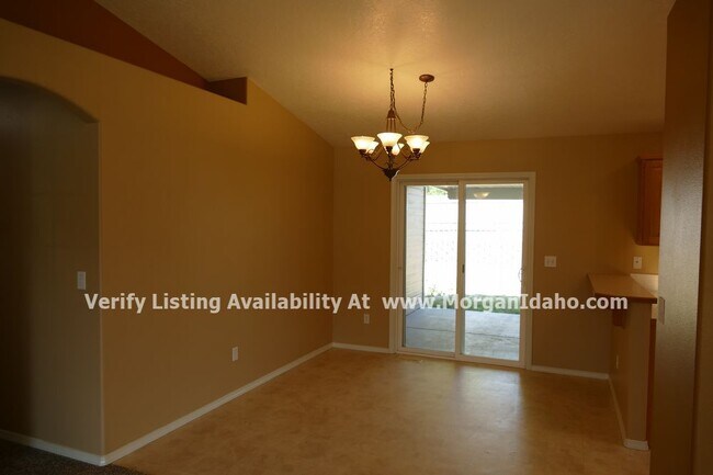 Building Photo - 3-car garage, storage shed, vaulted ceilin...