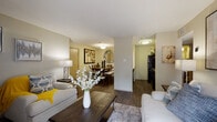 Located at 1400 Patricia in San Antonio, Texas, this single-floor residence offers a thoughtfully designed layout that balances comfort and functionality. The open-concept living area features rich wood-look flooring, neutral-toned walls, and a sliding glass door that floods the space with natural light while providing direct access to a private balcony with outdoor views. Built-in shelving adds character and practical storage to the living room.

The dining area flows seamlessly from the living space and is highlighted by a decorative sunburst mirror and warm wood tones, creating an inviting atmosphere for gatherings. Adjacent to the dining room, the kitchen is equipped with dark cabinetry, granite-style countertops, a tile backsplash, and black appliances including a range and refrigerator.

The bedrooms are carpeted for comfort, each featuring ceiling fans and windows that allow natural light to filter in. The bathroom is finished with a granite-top vanity, dark wood cabinetry, a large mirror, and a shower-tub combination with wood-look tile flooring. Throughout the residence, a cohesive warm color palette and consistent finishes create a welcoming and well-maintained living environment.
