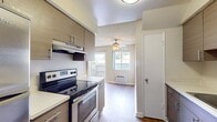 This contemporary 540 square foot apartment in La Mirada, California, offers a thoughtful blend of functionality and style. The single-story layout encompasses one spacious bedroom measuring 160 square feet, complemented by two full bathrooms for added convenience. The heart of the home is a sleek, renovated kitchen featuring modern wood-grain cabinetry, stainless steel appliances, and ample counter space. The open-concept design seamlessly connects the kitchen to the living area, creating a fluid and spacious feel. Throughout the apartment, warm-toned hardwood floors add a touch of elegance and continuity. Large windows in the bedroom and living area allow for plenty of natural light, enhancing the sense of space and providing pleasant views. Built-in closets offer practical storage solutions, while the neutral color palette provides a versatile backdrop for personalization. The bathroom showcases a clean, white aesthetic with a full-sized bathtub and shower combination. This apartment is well-suited for those seeking a low-maintenance, high-quality living space in a prime location.