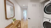Located at 1201 Rue De La Montagne in the heart of downtown Montréal, this thoughtfully designed unit offers three bedrooms and one bathroom across a single floor. The space showcases an urban industrial aesthetic, characterized by striking exposed concrete ceilings that contrast beautifully with clean white walls and warm light hardwood flooring throughout.

Each bedroom is well-proportioned, with the primary bedroom comfortably accommodating a queen-sized bed alongside built-in sliding closets. The bedrooms benefit from large windows that invite natural light and offer views of the surrounding cityscape. One bedroom features direct access to a balcony, further enhancing its connection to the outdoors.

The bathroom is finished in a clean, contemporary style with large-format light stone-effect floor tiles, a glass-enclosed shower, a built-in vanity with ample drawer storage, and open shelving — creating a bright, functional space.

A central hallway connects all rooms efficiently, maintaining a logical and practical flow throughout the unit. The overall ambiance is modern and understated, blending industrial architectural elements with soft, neutral finishes. Situated in one of Montréal's most vibrant and accessible neighbourhoods, this unit offers an ideal combination of style, functionality, and urban convenience.