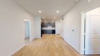 Located at 8300 Merrill Rd in Jacksonville, FL, this single-floor, 3-bedroom, 2-bathroom home offers a clean, modern aesthetic throughout. The open-concept living area and kitchen are anchored by light wood-look flooring and bright recessed lighting, creating a welcoming and functional space. The kitchen features dark, textured cabinetry with sleek hardware, light granite-style countertops, and a full suite of black appliances including a refrigerator, range, microwave, and dishwasher. The open layout allows the kitchen to flow naturally into the living area, making it ideal for everyday living. The three bedrooms are finished with plush carpeting and feature ceiling fans and window blinds that allow for ample natural light. The primary bedroom is a comfortable size with direct access to a well-organized walk-in closet with wire shelving. The two bathrooms mirror the home's modern design, showcasing dark cabinetry, granite-style countertops, and light tile flooring, with large windows providing natural light. The home also includes four closets and a hallway, offering generous storage throughout. The overall ambiance is bright, clean, and move-in ready.
