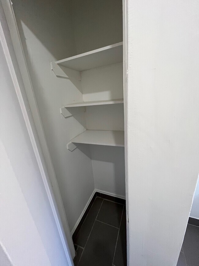 Convenient bathroom closet - 3023 W Wilson Ave
