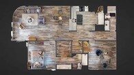 Located at 1300 Lake Howard Drive SW in Winter Haven, Florida, this single-floor residence offers a thoughtfully designed layout with contemporary finishes throughout. Wood-look flooring flows seamlessly across the entire unit, creating a cohesive and warm aesthetic from room to room.

The expansive living area is bright and welcoming, anchored by large sliding glass doors that open to a private balcony, filling the space with natural light and offering outdoor views. Track lighting with gold-toned fixtures adds a modern, stylish touch to the living room's clean, neutral palette.

The dining area sits adjacent to the living room, featuring an elegant pass-through opening that connects to the kitchen. The kitchen is well-appointed with rich, dark espresso cabinetry, white countertops, and a full suite of stainless steel appliances, including a range, over-the-range microwave, and refrigerator.

The bedrooms are generously proportioned, each equipped with ceiling fans and large sliding glass doors or windows that invite natural light. One bedroom provides direct balcony access, enhancing its sense of openness.

The primary bathroom features a dual-sink vanity with dark wood cabinetry, a wide mirror, and ample counter space. A second full bathroom includes a tub-shower combination. The overall ambiance is modern and refined, with carefully curated design details throughout.