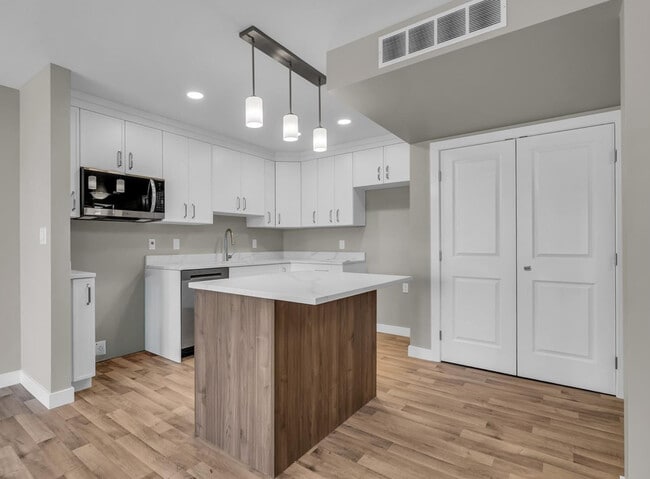 Quartz countertops and stainless steel appliances - 318 108 St