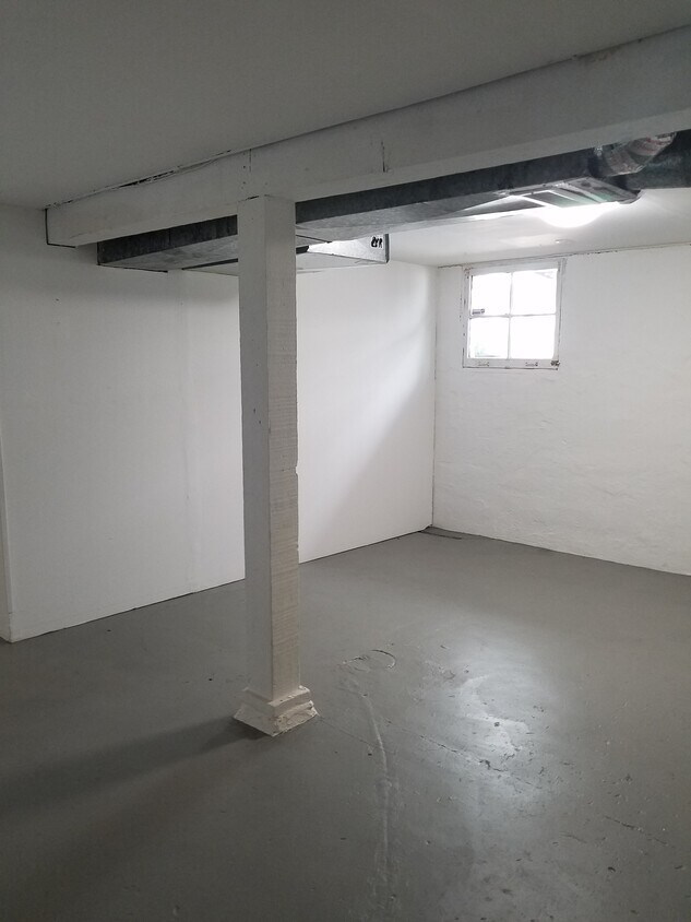 large clean basement with washer drier hook up and windows. And storage! - 2123 SE Ankeny St
