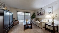 Located at 8550 Florin Rd in Sacramento, CA, this single-story residence offers two bedrooms and two bathrooms within a well-organized floor plan. The living room serves as the heart of the home, featuring plush carpeting, a textured ceiling, and a full-width sliding glass door with vertical blinds that opens to a private balcony, allowing natural light to fill the space. Adjacent to the living area, the dining room offers tile flooring, a bright window with vertical blinds, and enough space to comfortably seat four. The kitchen is equipped with warm wood cabinetry, granite-style countertops, white appliances including a range and built-in microwave, and easy-care tile flooring. The primary bedroom is a comfortable retreat with soft carpeting, a sliding-door closet, and a textured ceiling, while the second bedroom mirrors the same cozy aesthetic. Both bathrooms are clean and functional, featuring tile flooring, a shower-tub combination, and wood-toned vanity cabinetry with granite-style counters. Throughout the home, neutral tones and consistent finishes create a cohesive and welcoming ambiance well-suited for daily living in the Sacramento area.