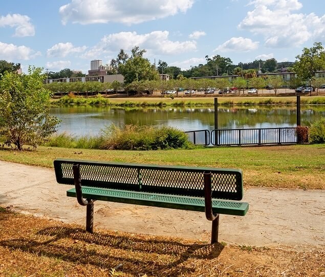 Carter-Howell-Strong Park features a small like surrounded by a paved walking path