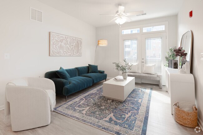 2 habitaciones, 2 baños - 911 pies cuadrados - Sala de estar - Joyfield Flats at Woodbridge