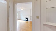Located at 2505 N Prospect Ave in Milwaukee's vibrant East Side neighborhood, this 4-bedroom, 1-bathroom home offers a well-distributed single-floor layout with generous overall living space. Classic hardwood flooring runs throughout the majority of the home, lending warmth and timeless character to each room.

The spacious primary bedroom features large windows that invite ample natural light and views of surrounding greenery, complemented by a ceiling fan and access to a closet with built-in shelving. The remaining three bedrooms are comfortably sized, each with hardwood floors, white walls, and windows providing natural light. Classic cast-iron radiators are present throughout, providing reliable heating and adding to the home's historic charm. Several bedrooms also include sliding wood-panel closet doors for practical storage.

The kitchen is equipped with solid oak cabinetry, ample counter space, a gas range, and a refrigerator. Stone-look tile flooring adds a practical, durable touch. The bathroom features a full tub-shower combination with white subway-style tile surround, a wood-framed vanity with mirror cabinet, and mosaic tile flooring. Multiple hallways and four closets ensure excellent storage and circulation throughout. The home's traditional architecture, combined with its functional layout, makes it a solid and character-rich Milwaukee residence.