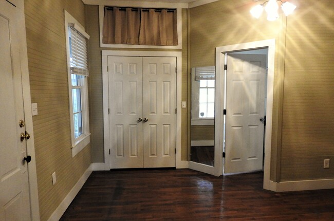 Primary bedroom with large lighted closet and overhead storage. - 3230 PARK AVE