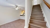 This two-story residence at 9712 Tartuffe Drive, Richmond, Virginia, offers 1010 square feet of living space. The home features 2 bedrooms and 3 bathrooms, with the primary bedroom boasting a generous 210 square feet. The ground floor spans 510 square feet, while the upper level provides 500 square feet.

The interior showcases a blend of carpeted and hardwood flooring throughout. The modern kitchen is equipped with light wood cabinetry, black appliances, and a curved breakfast bar with a double sink. Track lighting and recessed lights add a contemporary touch to the space.

Bedrooms are carpeted for comfort, with the primary bedroom featuring a ceiling fan and ample natural light from large windows. Bathrooms are designed with practicality in mind, offering bathtub-shower combinations and pedestal sinks.

French doors in one room lead to an outdoor area, allowing for seamless indoor-outdoor living. The home's layout includes a dining area, hallway, and two closets for storage. With its mix of textures and materials, this property presents a balanced blend of comfort and modern design elements.