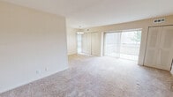 This 620 square foot, one-bedroom apartment in Wilmington, DE offers a practical and comfortable living space. The single-floor layout maximizes efficiency, with a generous 190 square foot primary bedroom. The interior showcases a neutral color palette with cream walls and plush beige carpeting throughout, creating a warm and inviting atmosphere.

The living area is brightened by large windows with vertical blinds, allowing for abundant natural light and potential outdoor views. A small dining nook is seamlessly integrated into the open-concept design. The bedroom features a spacious walk-in closet, providing ample storage.

The bathroom is well-appointed with a single vanity, large mirror, and a combination bathtub-shower unit. Modern light fixtures and neutral-toned tiles complete the space. The apartment's compact kitchen, while not visible in the images, likely offers essential appliances and cabinetry for basic cooking needs.

The property's layout includes an entrance, a hallway for easy navigation, and strategically placed electrical outlets for convenience. The smooth, textured ceilings and simple baseboards contribute to the apartment's clean, modern aesthetic. This apartment is well-suited for singles or couples looking for a low-maintenance, cozy home in an urban setting.