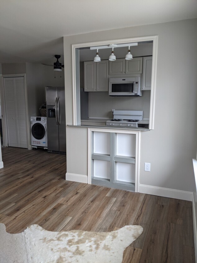 Custom built half-wall with built-in shelves and bar with dimmable and moveable light fixture - 413 S Hamilton St