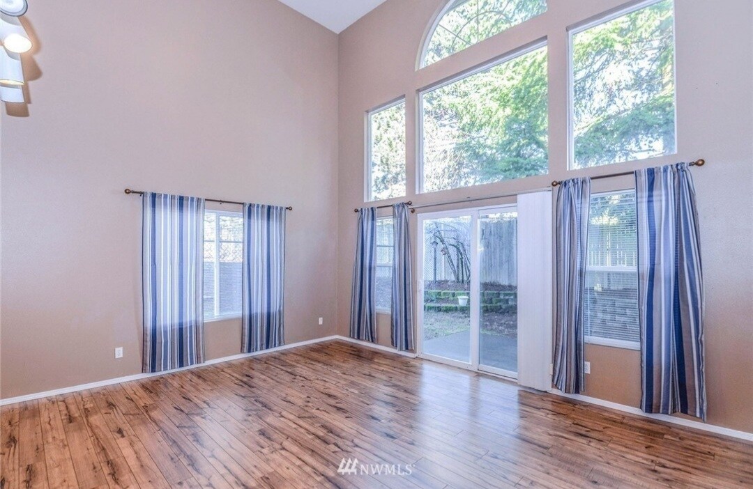 Living room- Cathedral ceiling with lots of natural light - 5517 136th St SE