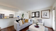 Located at 10750 Westbrae Parkway in Houston, TX, this well-appointed 2-bedroom, 2-bathroom home offers a functional single-floor layout designed for comfortable everyday living. The living room welcomes you with warm wood-look flooring, large windows fitted with blinds that invite natural light, and a clean, neutral color palette that creates an airy atmosphere throughout. Adjacent to the living area, the dining space features a stylish chandelier overhead and offers room for a full dining set, making it ideal for entertaining. The kitchen is efficiently laid out with white cabinetry, light countertops, a stainless sink, and black appliances, including a full-size refrigerator. The primary bedroom is generously proportioned, featuring plush carpet, a ceiling fan, a window with natural light, and direct access to a connected area. The second bedroom also offers carpet flooring and a ceiling fan for added comfort. Both bathrooms are finished with white tile tub-shower combinations, wood-look flooring, and light countertops, presenting a clean and classic aesthetic. A connecting hallway ties all rooms together efficiently. This home combines practical design with a neutral, move-in-ready interior in a well-situated Houston location.